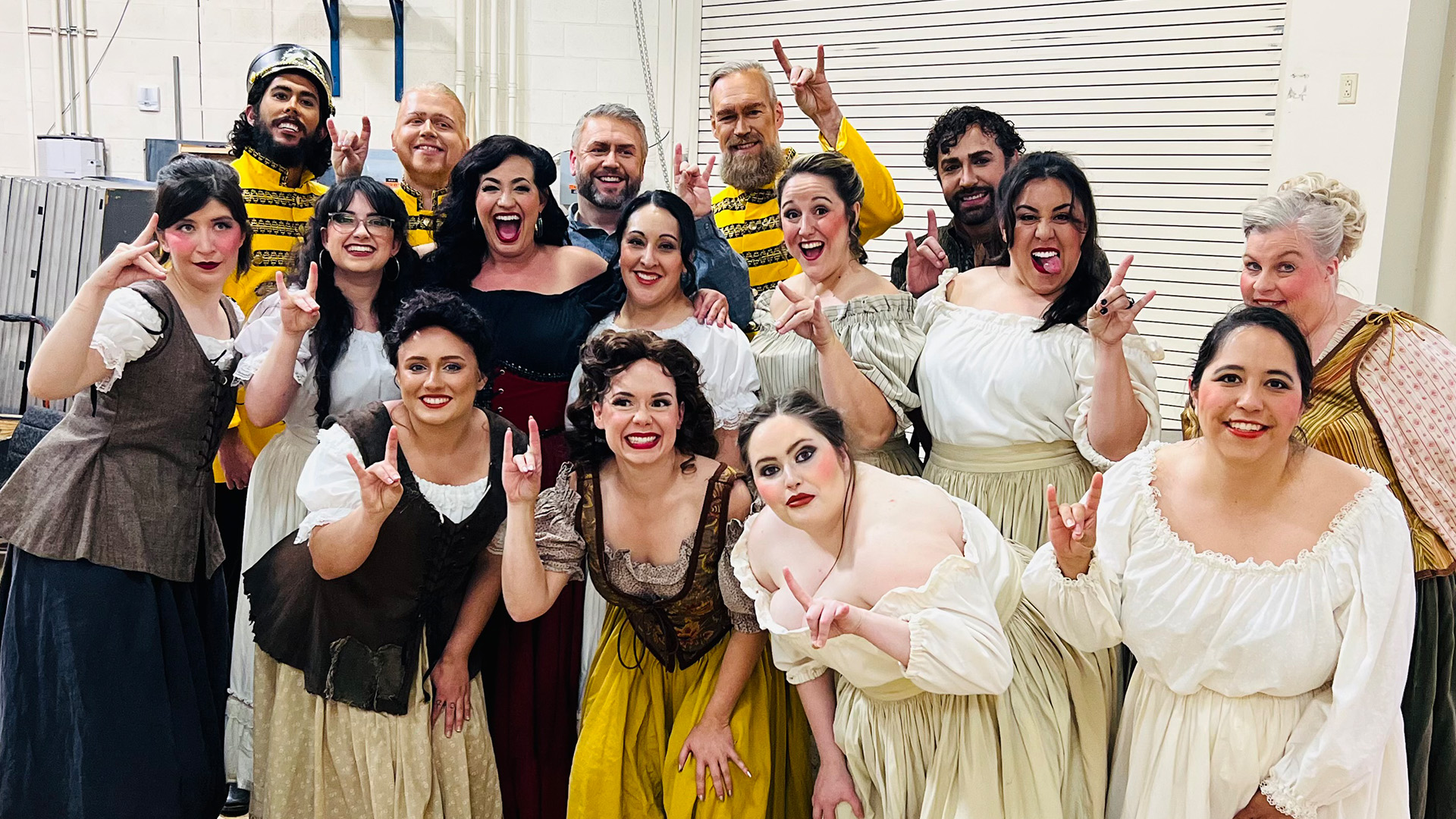 the cast members of Carmen pose for group shot backstage